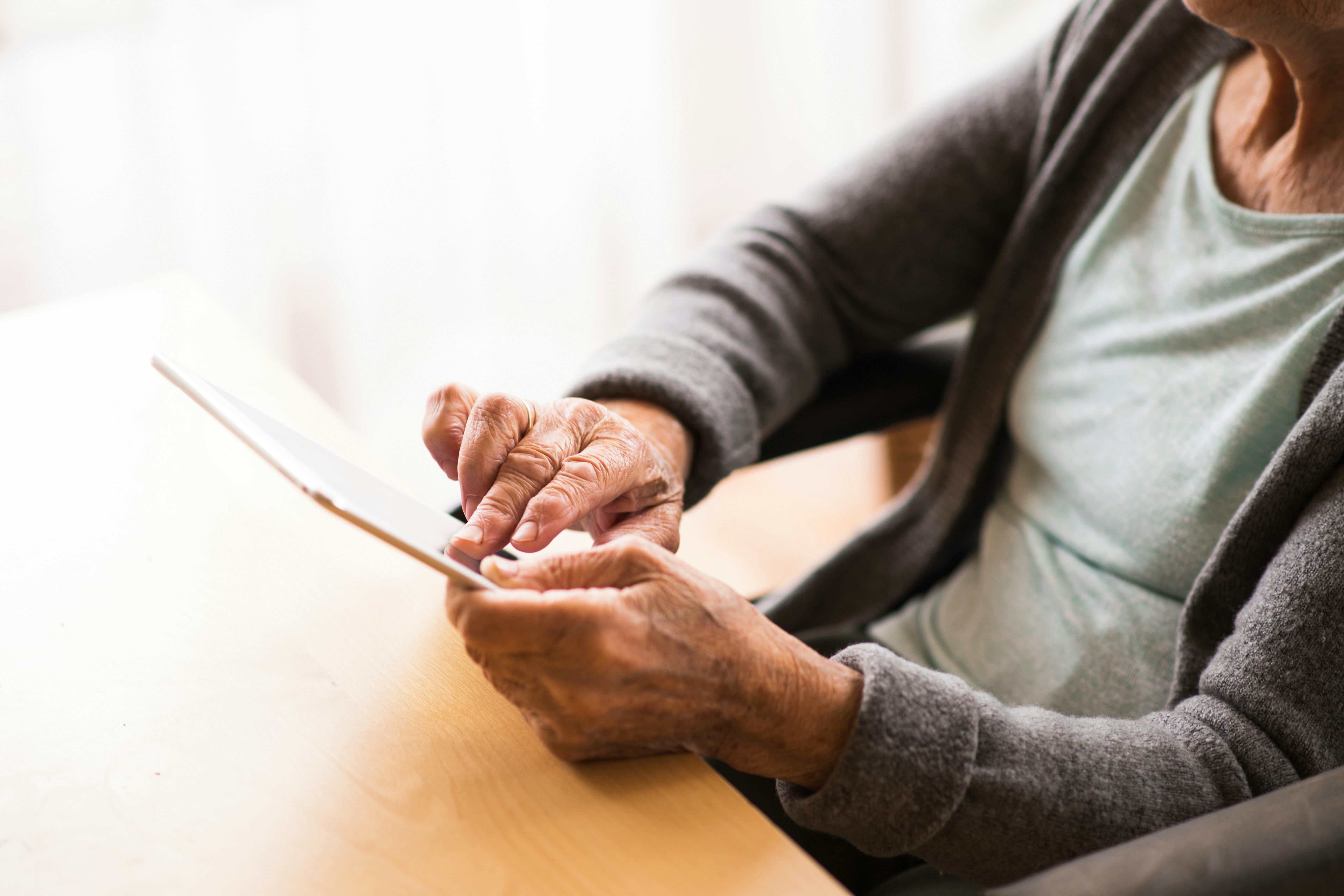 Elderly female resident using an ipad
