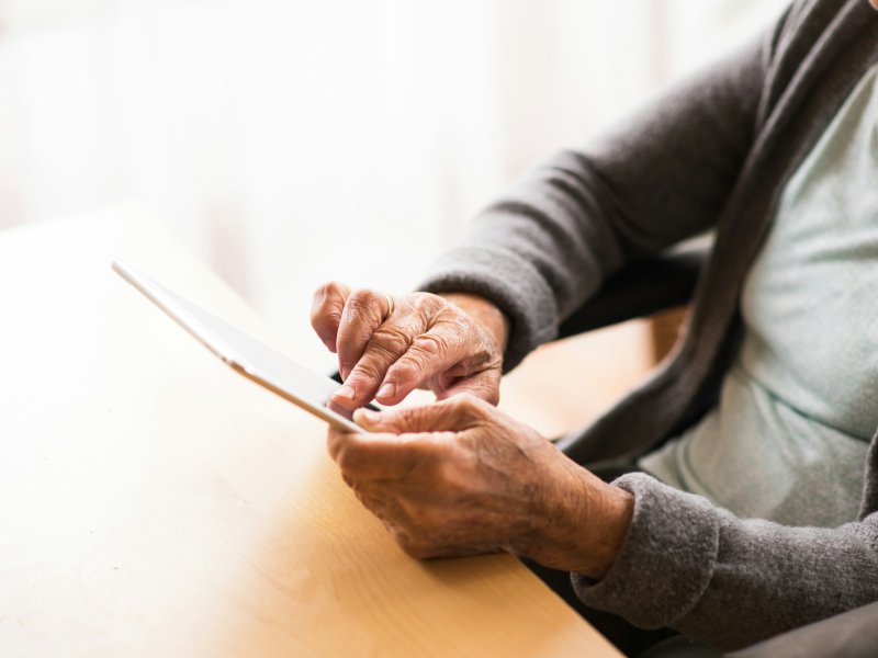Elderly female resident using an ipad