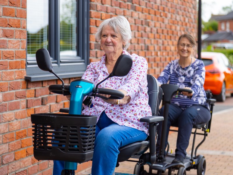 Lace Housing residents on mobility scooters