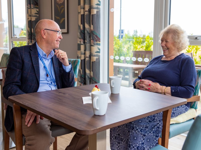 Lace Housing staff meeting with resident for a coffee and cake