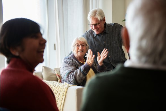 Elderly lady and her partner smiling