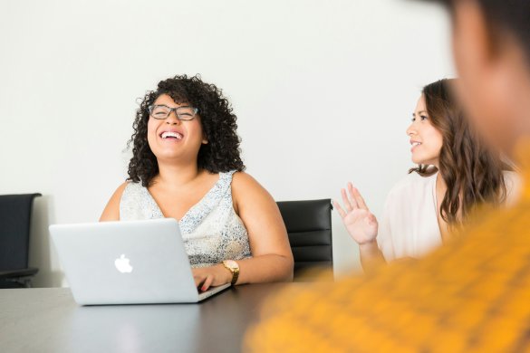 Staff members laughing and smiling