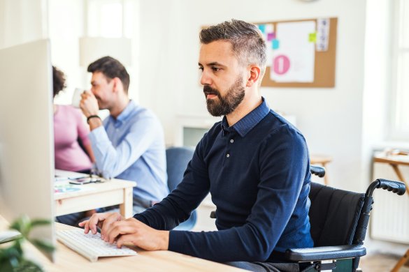 Male staff member working on the computer