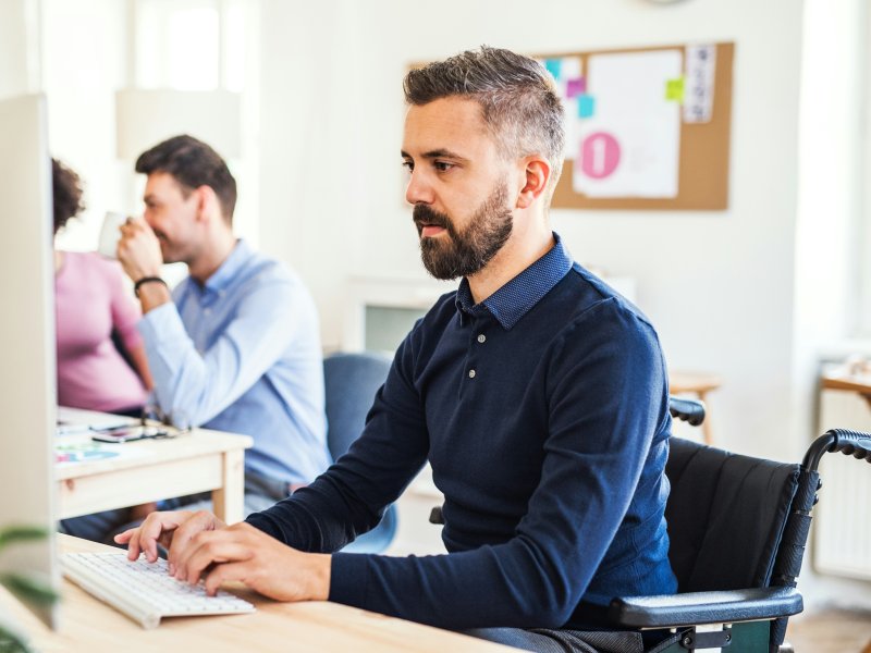 Male staff member working on the computer