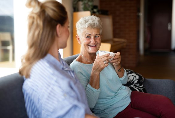 Volunteer talking to elderly resident