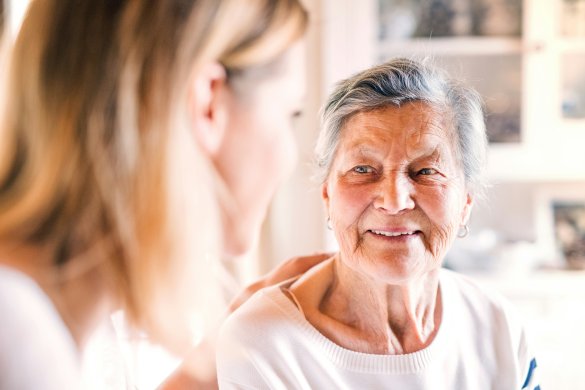 Female resident being reassured.